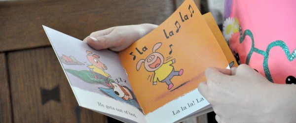 Little girl reading lalalala